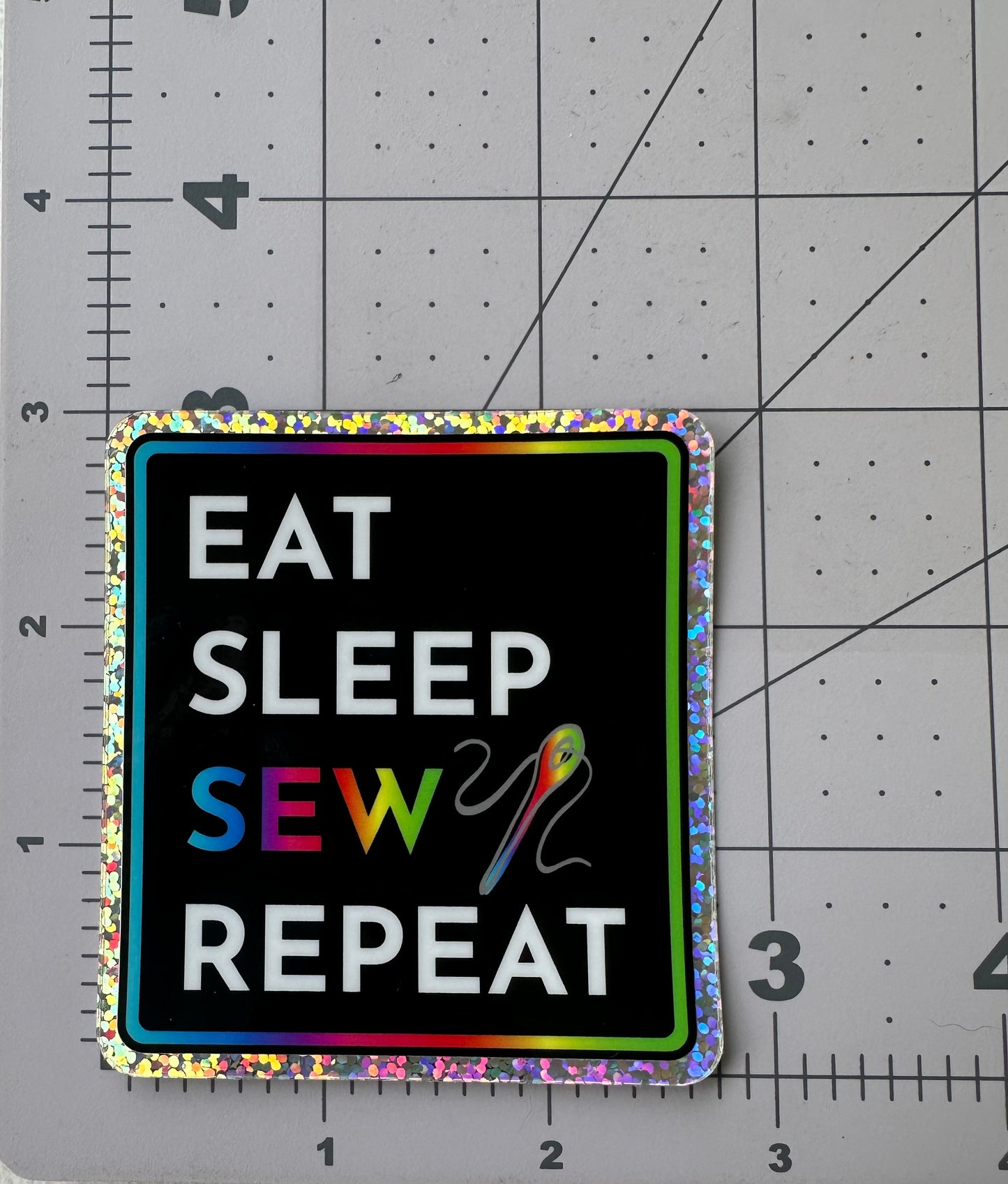 "EAT. SLEEP. SEW. REPEAT." - Holographic Glitter Sticker