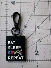 Load image into Gallery viewer, Color Printed Bag Charms - Eat Sleep Sew Repeat - Black Acrylic
